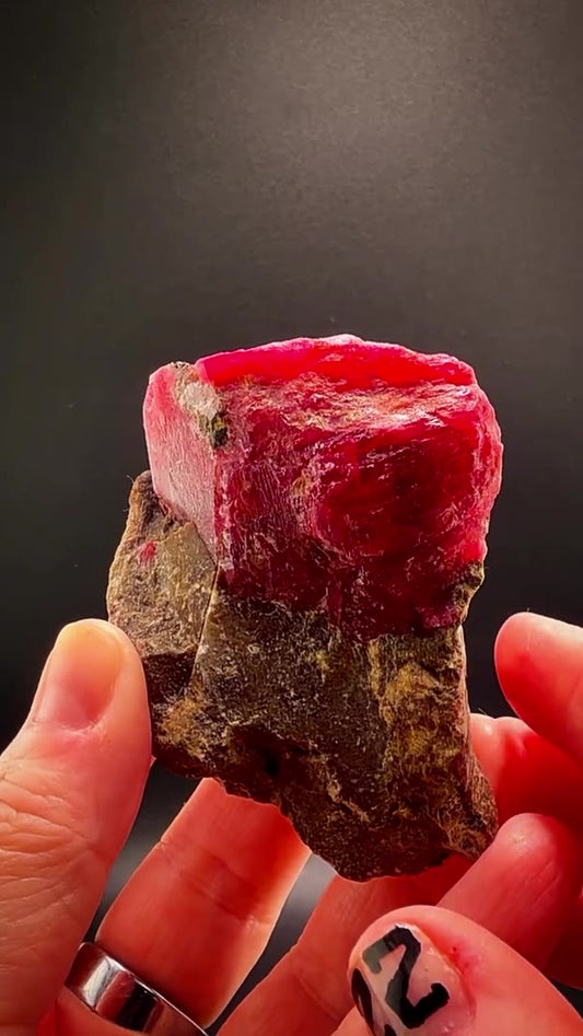 210.05 GRAMS OF CHERRY-RED RHODONITE ON MATRIX