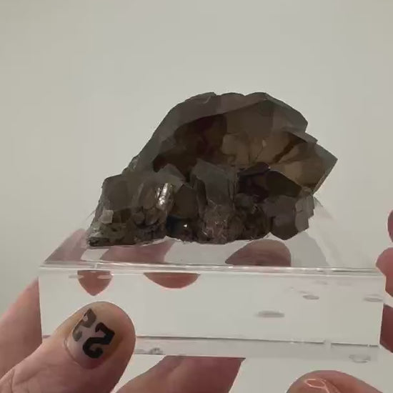 Discover the breathtaking beauty of Smoky Quartz Gwindel Cluster from…
