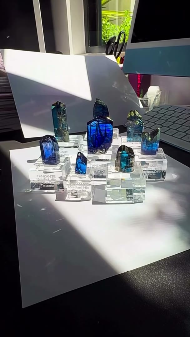 Sunlight cutting across the desk… shadows stretching… and the Tanzanites…